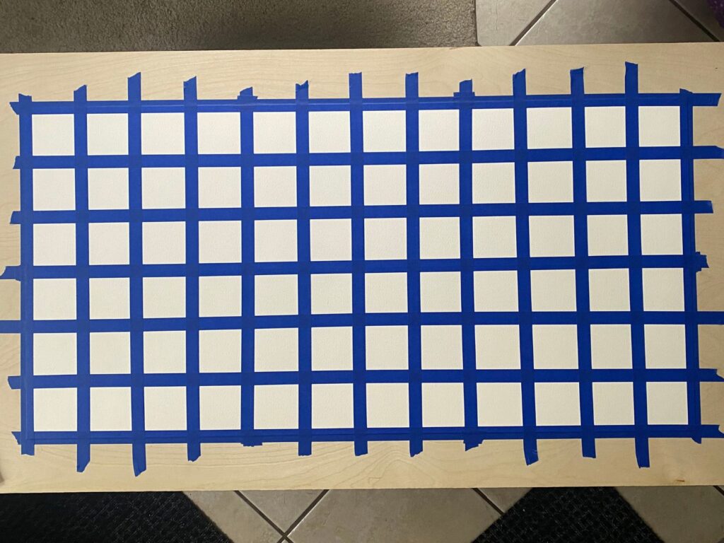 Cotton paper taped to the work surface and divided into a grid of 72 squares before painting began.